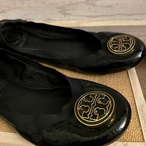 Tory Burch well-loved black slip ons